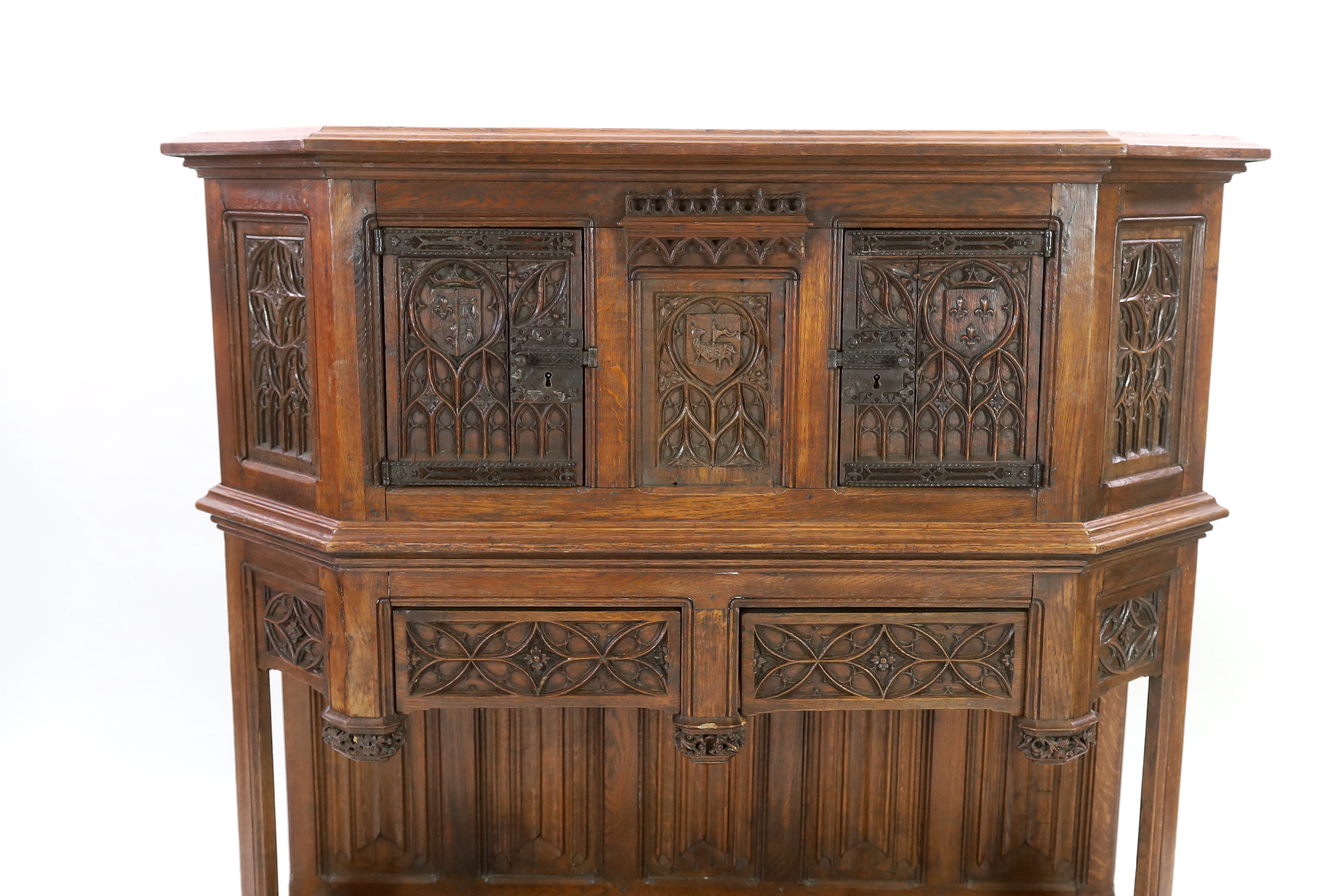 An antique oak dresser, based on a 15th century French gothic model and very similar to an example in the Wallace Collection